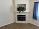 Living room showing a cozy fireplace and tile floors at 311 Manti Pl # 311, Henderson, NV 89014