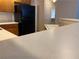 Kitchen area showcasing a breakfast bar and stainless steel appliances at 311 Manti Pl # 311, Henderson, NV 89014