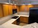Bright kitchen featuring track lighting, wood cabinets, and white countertops at 311 Manti Pl # 311, Henderson, NV 89014