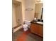 Bathroom features a shower-tub combo, vanity with a black countertop, and tile flooring at 3125 N Buffalo Dr # 1080, Las Vegas, NV 89128