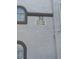 Close-up of a building's exterior featuring arched windows and clear signage displaying apartment numbers at 3125 N Buffalo Dr # 1080, Las Vegas, NV 89128