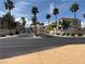 Street view of the Mar-A-Lago community entrance showcasing beautiful landscaping and well-maintained buildings at 3125 N Buffalo Dr # 1080, Las Vegas, NV 89128