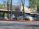 View of Restaurant Row sign in commercial area with valet parking and a flower shop / garden center at 3125 N Buffalo Dr # 1080, Las Vegas, NV 89128
