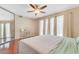 Comfortable bedroom with wood floors, soft lighting, and a view to the outdoor space at 3920 Autumn St, Las Vegas, NV 89120