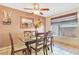 Inviting dining space with seating for six, stylish decor, and a view of the serene outdoor scenery at 3920 Autumn St, Las Vegas, NV 89120