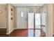 Inviting entryway with hardwood floors, a mirror, and sidelight windows, offering plenty of natural light at 3920 Autumn St, Las Vegas, NV 89120