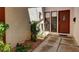 Close-up of the front door with small garden area at 3920 Autumn St, Las Vegas, NV 89120