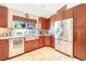 Kitchen with stainless steel appliances, farm sink, granite countertops, and custom cabinets at 3920 Autumn St, Las Vegas, NV 89120