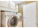 Well-equipped laundry room with modern washer and dryer, ample storage space, and a convenient layout at 3920 Autumn St, Las Vegas, NV 89120