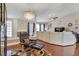 Spacious living room with hardwood floors, a chandelier, and fireplace at 3920 Autumn St, Las Vegas, NV 89120