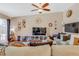 Spacious living room with ceiling fan, hardwood floors, neutral paint, and comfortable sectional sofa at 3920 Autumn St, Las Vegas, NV 89120