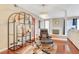 Cozy living area with a decorative fireplace, a large armchair, and stylish shelving, perfect for relaxation at 3920 Autumn St, Las Vegas, NV 89120