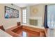 Bright living area with a unique fireplace, built-in seating, and ample natural light from a large window at 3920 Autumn St, Las Vegas, NV 89120