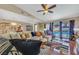 Bright and airy living room with view of backyard pool through the sliding glass doors at 3920 Autumn St, Las Vegas, NV 89120