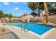 Sparkling pool surrounded by a beautifully tiled deck and mature landscaping for a relaxing outdoor experience at 3920 Autumn St, Las Vegas, NV 89120