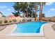 Backyard swimming pool features desert landscaping and perimeter wall at 3920 Autumn St, Las Vegas, NV 89120