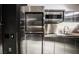 Contemporary kitchen with stainless steel appliances and sleek countertops at 4381 W Flamingo Rd # 1212, Las Vegas, NV 89103