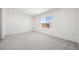 Bright bedroom with soft carpeting, a window, and ample space at 4510 E Brusca Way, Pahrump, NV 89061