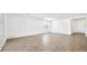 Open-concept living room featuring neutral paint and wood-look tile at 4510 E Brusca Way, Pahrump, NV 89061
