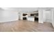 Open-concept living room and kitchen featuring wood-look tile flooring at 4510 E Brusca Way, Pahrump, NV 89061