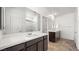 Modern main bathroom featuring dual sinks, a large mirror, and a glass-enclosed shower at 4510 E Brusca Way, Pahrump, NV 89061