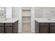 Dual sink main bathroom with large mirrors and walk in closet at 4510 E Brusca Way, Pahrump, NV 89061