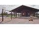 Community pavilion featuring picnic tables, swings and lush landscaping at 4510 E Brusca Way, Pahrump, NV 89061