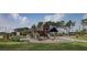 Community playground featuring a wooden play structure, slides, and lush green lawn at 4510 E Brusca Way, Pahrump, NV 89061