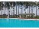 Community pool with clear blue water, lounge chairs, and a lifeguard stand at 4510 E Brusca Way, Pahrump, NV 89061