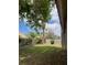 Lush backyard featuring a green lawn, privacy wall and mature landscaping, perfect for outdoor enjoyment at 4931 Crystal Breeze Ln, North Las Vegas, NV 89031