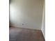 An empty bedroom features neutral walls, carpet flooring, and electrical outlets at 4931 Crystal Breeze Ln, North Las Vegas, NV 89031