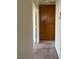 Hallway includes a wooden cabinet for storage at 4931 Crystal Breeze Ln, North Las Vegas, NV 89031