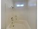 Bathroom with a tub and shower, all-white surround at 5043 Spencer St # A, Las Vegas, NV 89119