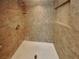 Tiled walk-in shower with a built-in seat and shelf at 5043 Spencer St # A, Las Vegas, NV 89119