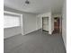 This bedroom features neutral carpeting, a large window with natural light, and a mirrored closet at 5043 Spencer St # A, Las Vegas, NV 89119