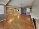 Spacious living room with hardwood floors, a fireplace, and abundant natural light from the windows at 5043 Spencer St # A, Las Vegas, NV 89119