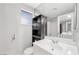 Well-lit bathroom with a vanity, modern fixtures, and a large mirror at 5120 Burnham Ave, Las Vegas, NV 89119