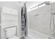 Neat bathroom featuring a toilet, tub-shower combo, and modern fixtures and cabinet at 5120 Burnham Ave, Las Vegas, NV 89119