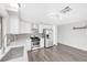 Updated kitchen features stainless steel appliances, white cabinets, grey backsplash, and modern finishes at 5120 Burnham Ave, Las Vegas, NV 89119