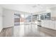 Bright kitchen with white cabinets, stainless steel appliances, and large windows overlooking the backyard at 5120 Burnham Ave, Las Vegas, NV 89119