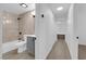 Neutral-toned bathroom featuring tiled shower, modern vanity, and well-lit entrance at 5241 Janfred Ct # 26, Las Vegas, NV 89103