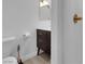 Bathroom with a sleek vanity, stylish fixtures, and a toilet at 5241 Janfred Ct # 26, Las Vegas, NV 89103