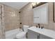 Cozy bathroom featuring a shower-tub combo, modern vanity, and stylish fixtures at 5241 Janfred Ct # 26, Las Vegas, NV 89103