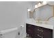 Powder room featuring an ornate mirror, stylish fixtures, and a modern vanity at 5241 Janfred Ct # 26, Las Vegas, NV 89103