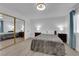 Bright bedroom with a large closet with mirrored doors and wood-look flooring at 5241 Janfred Ct # 26, Las Vegas, NV 89103