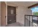 Close up of a front door in a condo complex, featuring dark door and sturdy hardware at 5241 Janfred Ct # 26, Las Vegas, NV 89103
