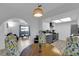 Bright kitchen and open floor plan featuring white cabinetry and stainless steel appliances at 5241 Janfred Ct # 26, Las Vegas, NV 89103