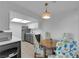 Eat-in kitchen features stainless steel appliances, modern cabinets, and stylish light fixture at 5241 Janfred Ct # 26, Las Vegas, NV 89103
