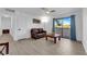 Comfortable living room with stylish floors, modern ceiling fan, and access to balcony at 5241 Janfred Ct # 26, Las Vegas, NV 89103