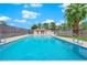 Sparkling swimming pool with an adjacent bath house and blue sky at 5241 Janfred Ct # 26, Las Vegas, NV 89103